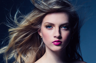 Fototapeta premium Beautiful blonde woman with pink lipstick beauty model