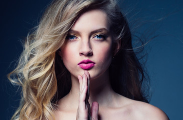 Beautiful blonde woman with pink lipstick beauty model