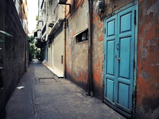 Fototapeta premium Old blue door on a red wall.