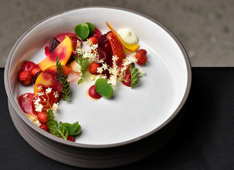 Fine dining dessert, Raspberry Parfait, ice cream, white chocolate mousse and spices