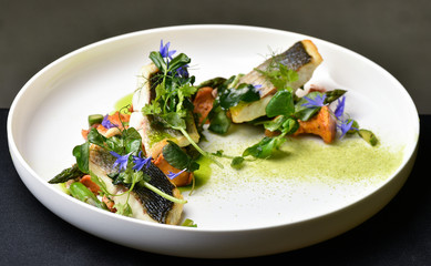 Fine dining, white fish fillet breaded in herbs and spice with asparagus