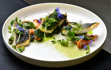 Fine dining, white fish fillet breaded in herbs and spice with asparagus