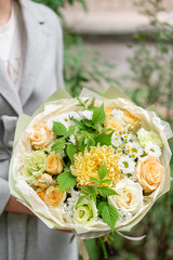 Beautiful spring bouquet. Arrangement with mix flowers. The concept of a flower shop, a small family business.