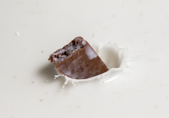 Chocolate falls in milk