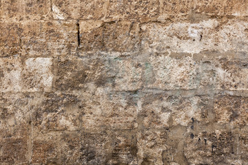 Background of old vintage dirty brick wall with peeling plaster, texture