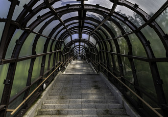 Ladder up to mountain in curve tunnel