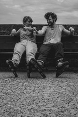 Young people friends relaxing on bench.