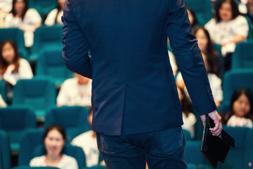 The Speaker Talking About Business Conference. Audience at the conference hall. Business and Entrepreneurship event.