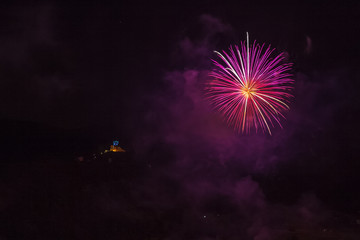 Violet fireworks with illuminated church of the patron saint of the city background, Vittorio...