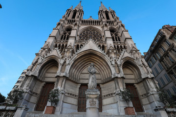 Fototapeta na wymiar View of Saint-Vincent de Paul church at the top of La Canebiere in Marseille.