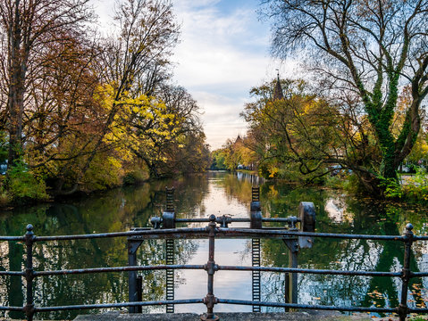 View on tower in Augsburg during autumn with water reflections