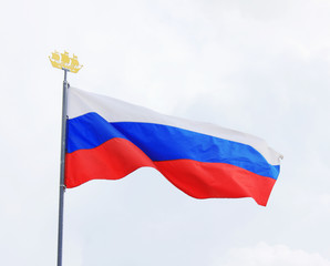 Flag of Russia Isolated on Cloudy Sky Background. National Flag of Russia, Country Symbol View on Gloomy Weather. Russian Flag of White, Blue and Red Color on Mast Waving on Empty Sky Background.