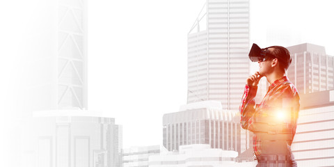 Guy wearing checked shirt and virtual mask holding hand on chin