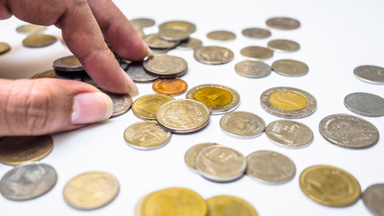 Fototapeta premium Close up hand and coin thai bath on white background