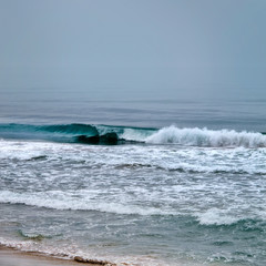 seascape image of stormy weather on beach