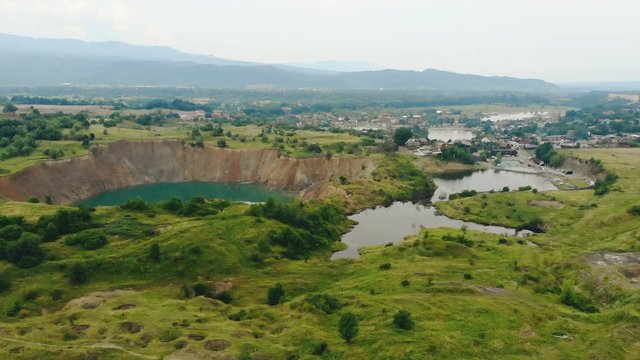 Large karst dips due to flooded salt mines near Solotvyno, Slatina. The technological catastrophe is caused by a human factor. 4k.