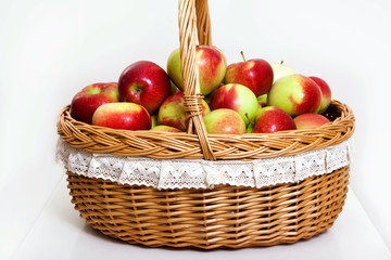 red white green apple purse basket background wood table wicker wattled braided lace