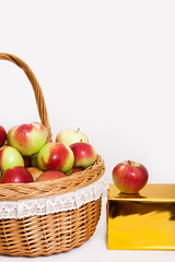 red white green apple purse basket background wood table wicker wattled braided lace golden gift box