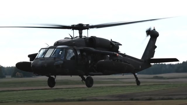 Engineers of the US Army waiting for the landing of a combat helicopter