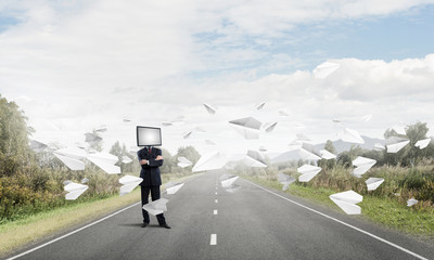 Businessman with TV instead of head.