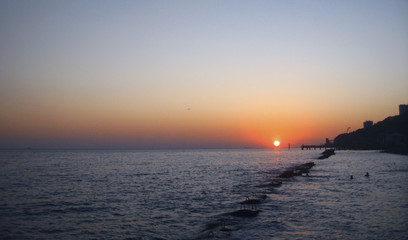 Fototapeta na wymiar Sunset Over The Sea. Evening on the seashore. Black sea seaside