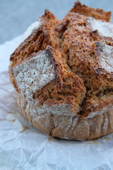 Fresh bread on paper wrapping