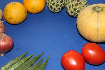 Fruits and vegetables arranges over the edges to be use as a background