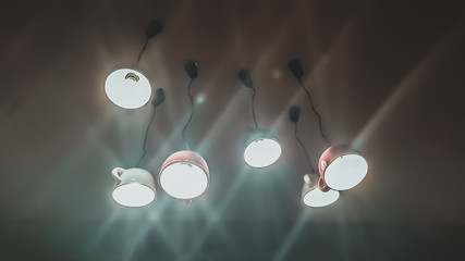 close up round lamp, yellow light on dark background, idea and creativity concept