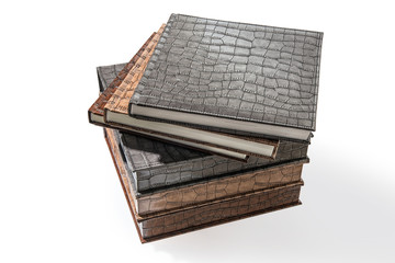 hardcover books lying on a white background