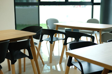 chair & table in food court canteen center. blur background