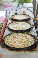 mussel and crab stick fried in egg batter (mussel and crab stick omelette)