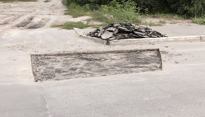 
bad asphalt road, repair of asphalt road,  pit on the road