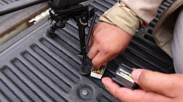 Slow Motion: Snipers are prepared with equipment of firearms to the mission footage