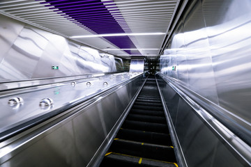 Obraz premium Escalator in the city leading to the underground passage of the subway