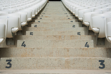 Empty white seats in stadium