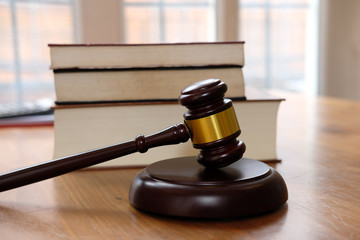 judge gavel & law book at courtroom. lawyer attorney justice workplace