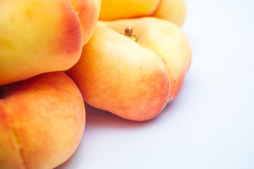 Organic peaches on white background