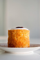 Runeberg's tart or cake is a Finnish traditional dessert and pastry that is originally made of gingerbread and bread crumbs, almonds, while rasberry jam and sugar on top