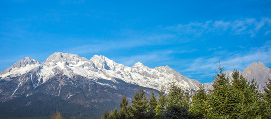 Fototapeta na wymiar Looking from the distance to the top of Jade Dragon Snow Mountain, Lijiang, Yunnan, China