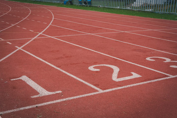 lane number & running racetrack, backstretch in outdoor sports stadium arena