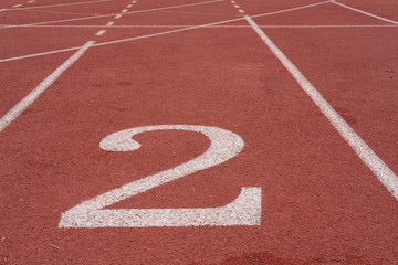 lane number & running racetrack, backstretch in outdoor sports stadium arena