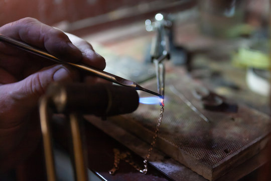Work of the master, jeweler. Jewelry repair shop. Manufacturing of jewelry.