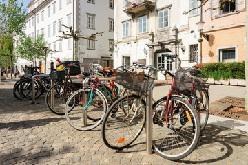 Fototapeta na wymiar Bicycles parked in Street of Ljubljana in Slovenia
