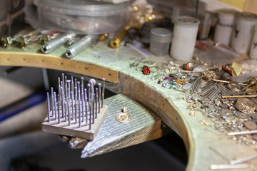 Work of the master, jeweler. Jewelry repair shop. Manufacturing of jewelry.