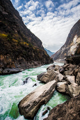 From the heights, overlook the majestic Jinsha River and the mountains on both sides, in Lijiang, Yunnan, China.