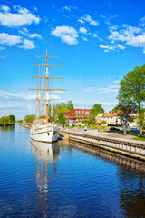 Fototapeta na wymiar Ship at embankment of Dane River in Old town Klaipeda