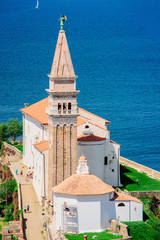 Fototapeta na wymiar Cityscape with Church tower in Piran at Adriatic Sea Slovenia