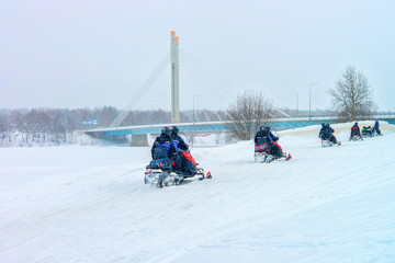 People on Snowmobiles in Winter Finland Lapland in Christmas