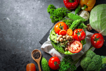 Various fresh vegetables organic food for healthy on dark rustic background with copy space for your text.