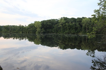 Summer evening reflections on a calm Midwestern lake